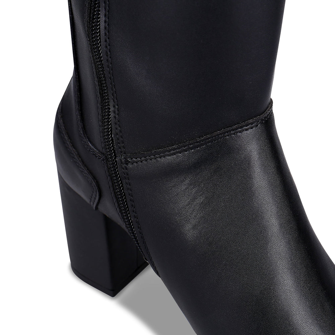 close view of heeled black boots with zipper | NAE Vegan Shoes
