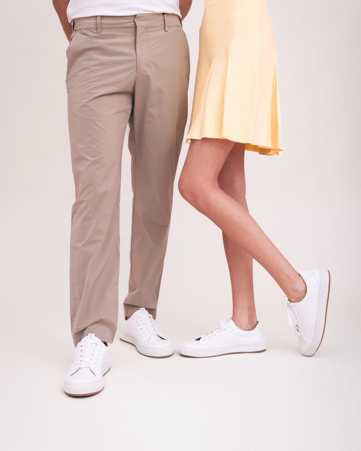 lifestyle picture unisex white vegan trainers with skirt and trousers