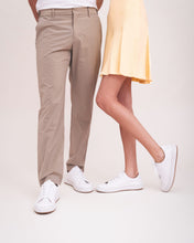 Load image into Gallery viewer, lifestyle picture unisex white vegan trainers with skirt and trousers