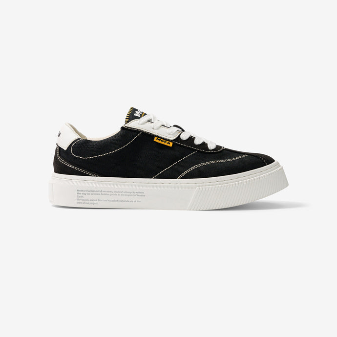 baskets en toile noire avec semelle blanche, style Vans