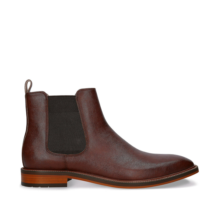 Brown leather Chelsea boot on a white background