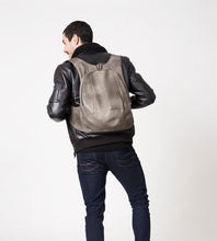 Load image into Gallery viewer, champagne metallic color Arsayo backpack with a man model