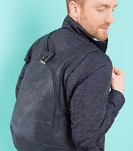 Load image into Gallery viewer, photo of the blue navy Arsayo  backpack with a man model