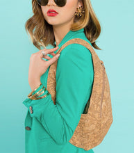 Load image into Gallery viewer, photo of the light natural cork Arsayo backpack with a woman model