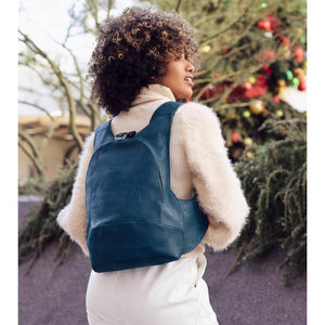 peacock blue Arsayo backpack with a woman model