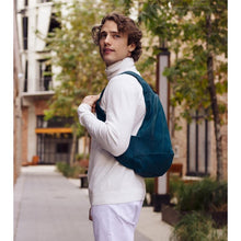 Load image into Gallery viewer, peacock blue Arsayo backpack with a man model