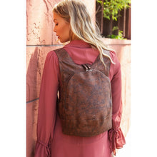 Load image into Gallery viewer, photo of the dark natural cork Arsayo backpack with a woman model