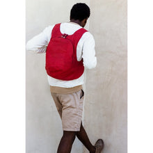 Load image into Gallery viewer, photo of the red Arsayo  backpack with a man model