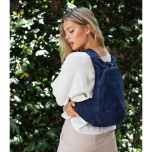Load image into Gallery viewer, photo of the blue navy Arsayo  backpack with a woman model
